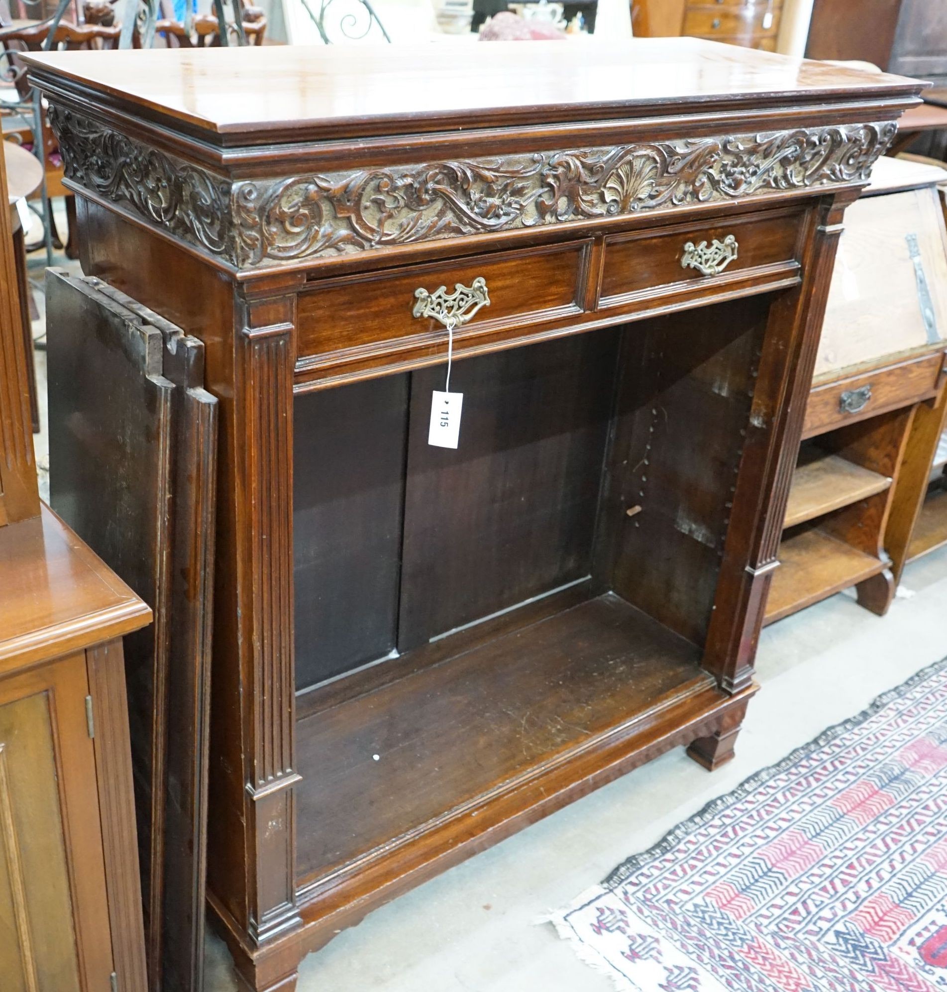 A late Victorian mahogany open bookcase, width 114cm, depth 46cm, height 125cm